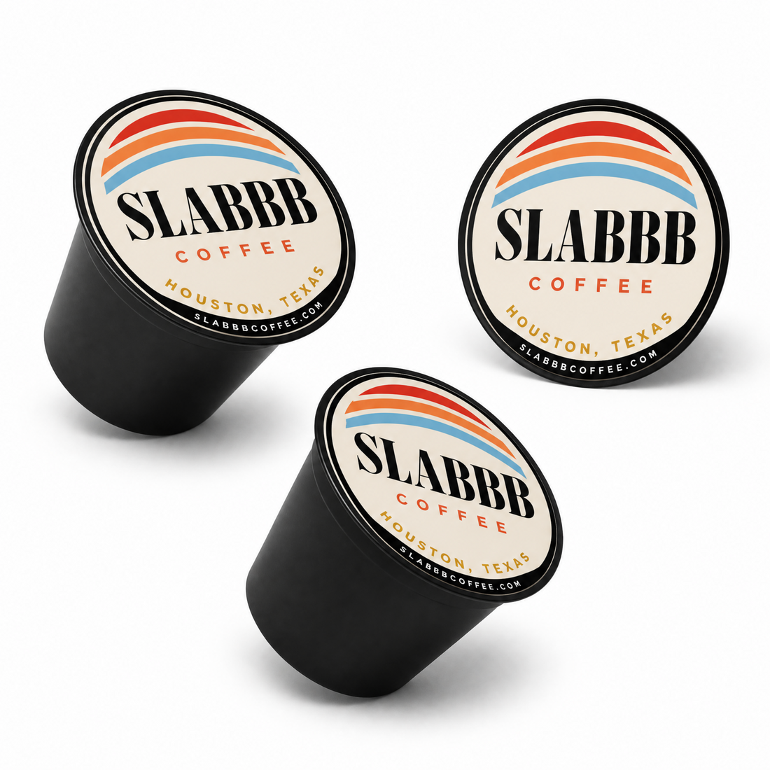 Three SLABBB Coffee capsules on a white background