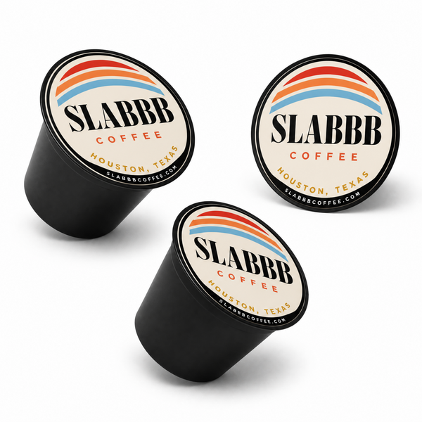 Three SLABBB Coffee capsules on a white background